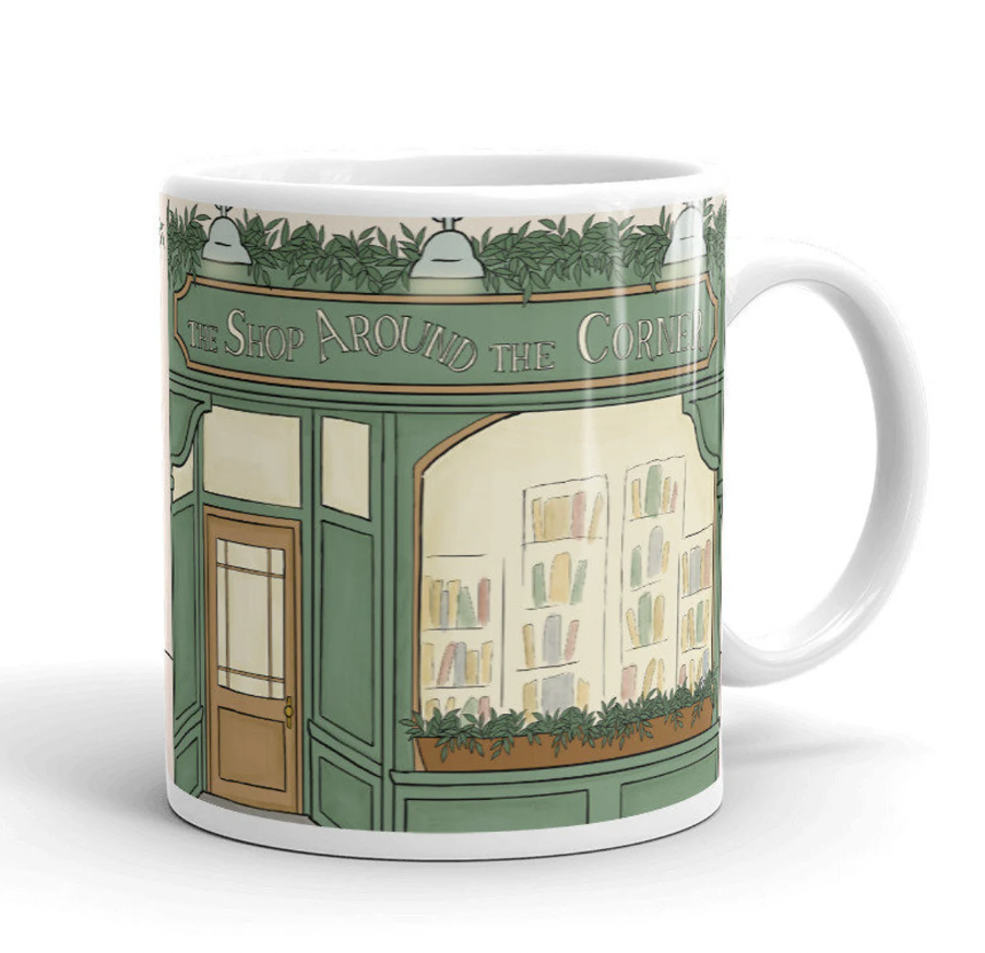 A mug with an illustration of a bookshop on it 