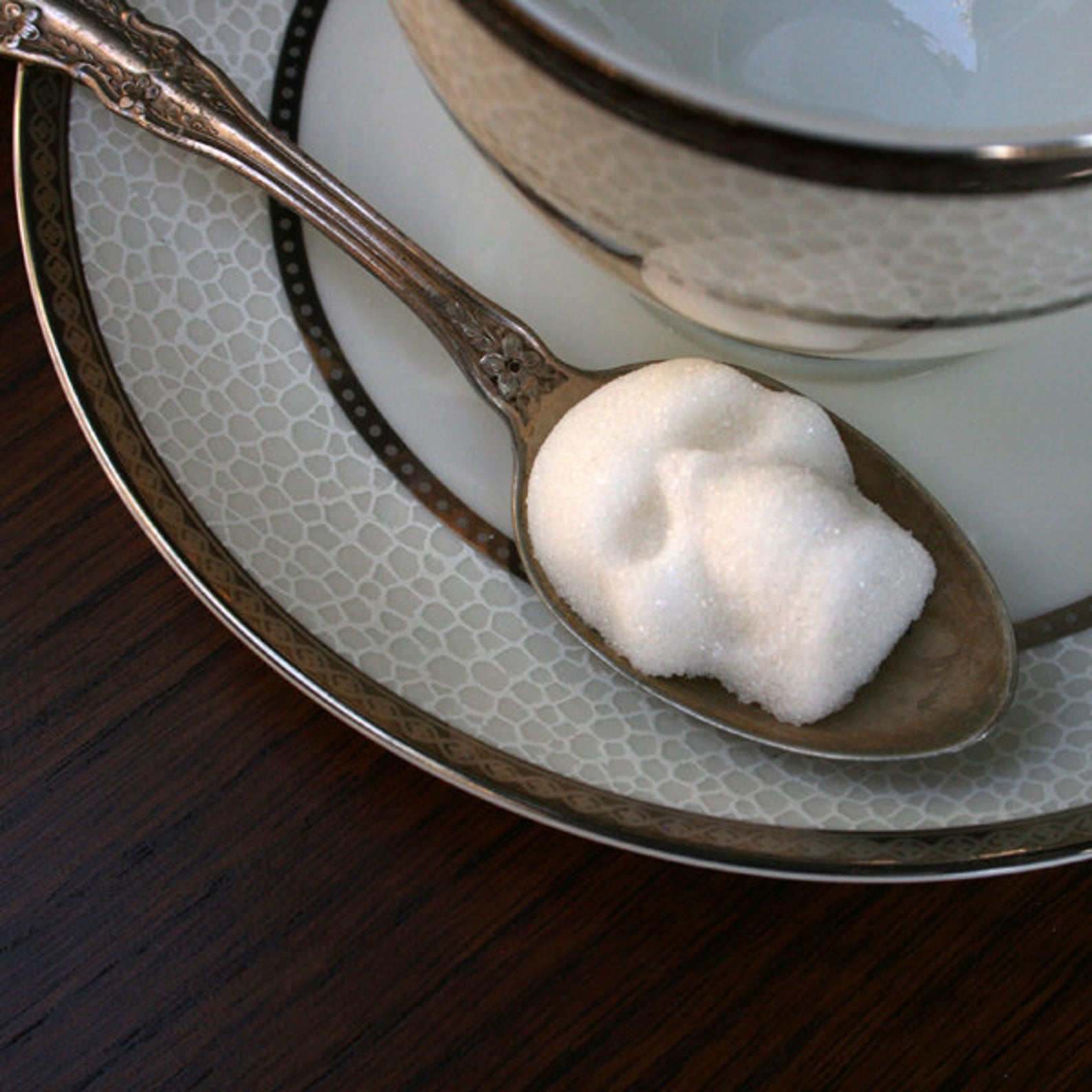 skull shaped sugar cube on a spoon