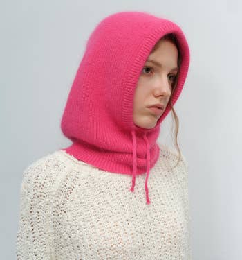 model wearing the hood in bright pink