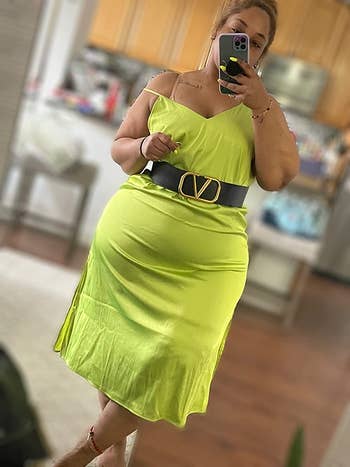 reviewer wearing the dress in lime green