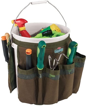 the brown apron around a bucket, pockets filled with tools