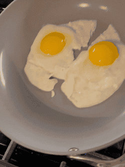 a gif of eggs sliding with ease on the pan