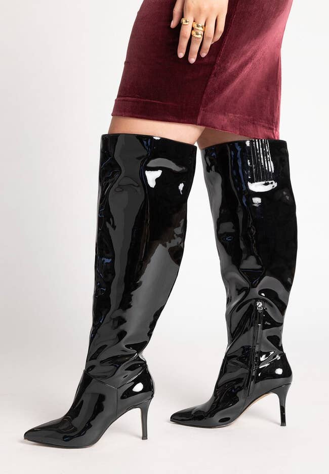 model in the black metallic boots