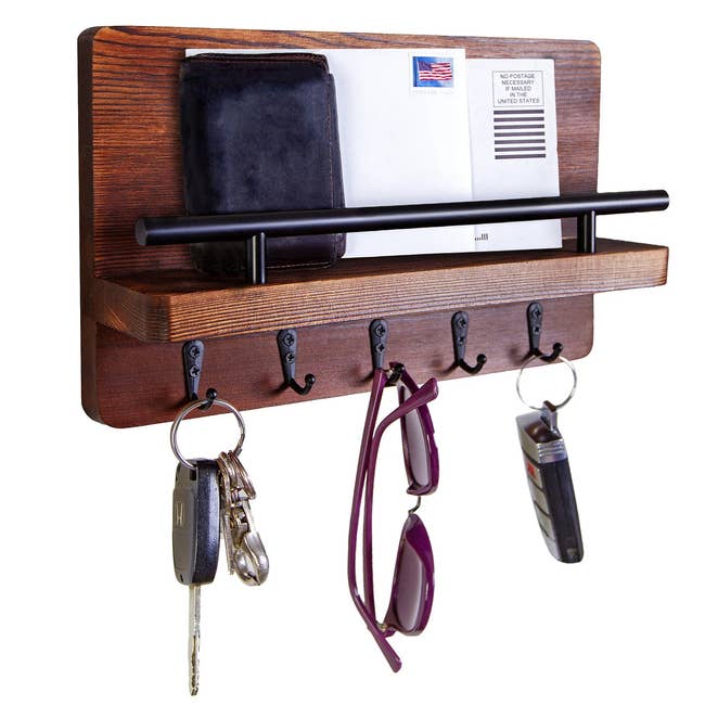 Reviewer's wood mail organizer storing mail, keys, and sunglasses
