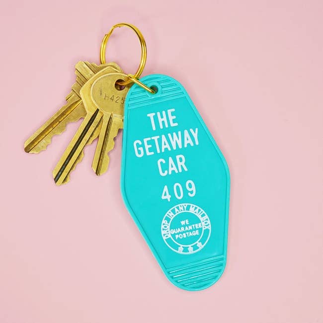 the teal keyring, which looks like a classic motel keyring, with 