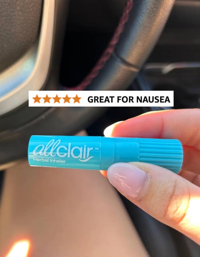 Person holding a herbal inhaler with 