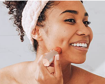 Model using it to remove hair from their face 