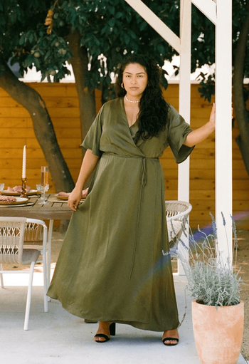 model in the green wrap dress