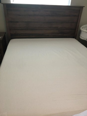 Same sheets spread tightly across mattress 