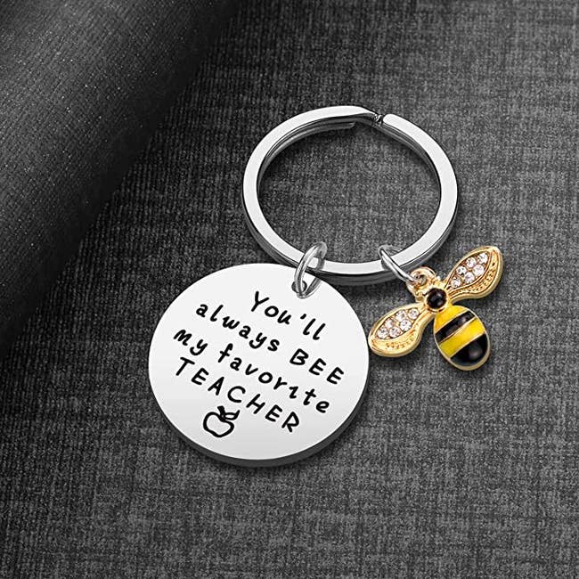keychain with a bee charm that says 