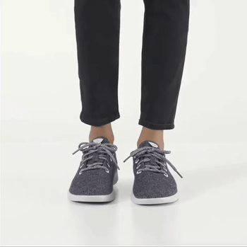 GIF of model wearing natural grey Allbirds women's wool runners, showing side view and flexing foot