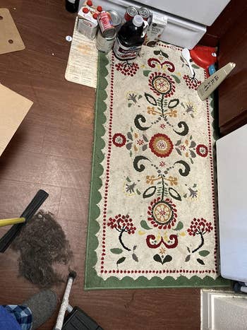 The same rug, which now looks cleaner and brighter after the pet hair has been removed
