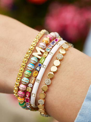 model wearing the bracelet as part of a stack