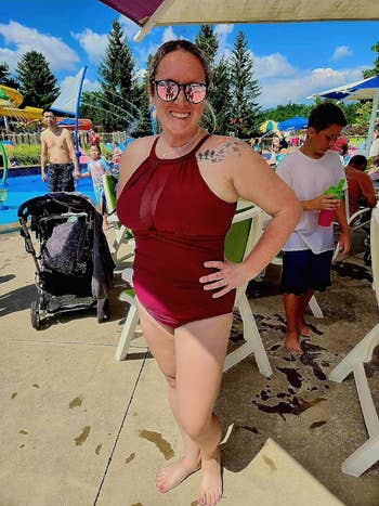 a reviewer wearing the swimsuit in burgundy