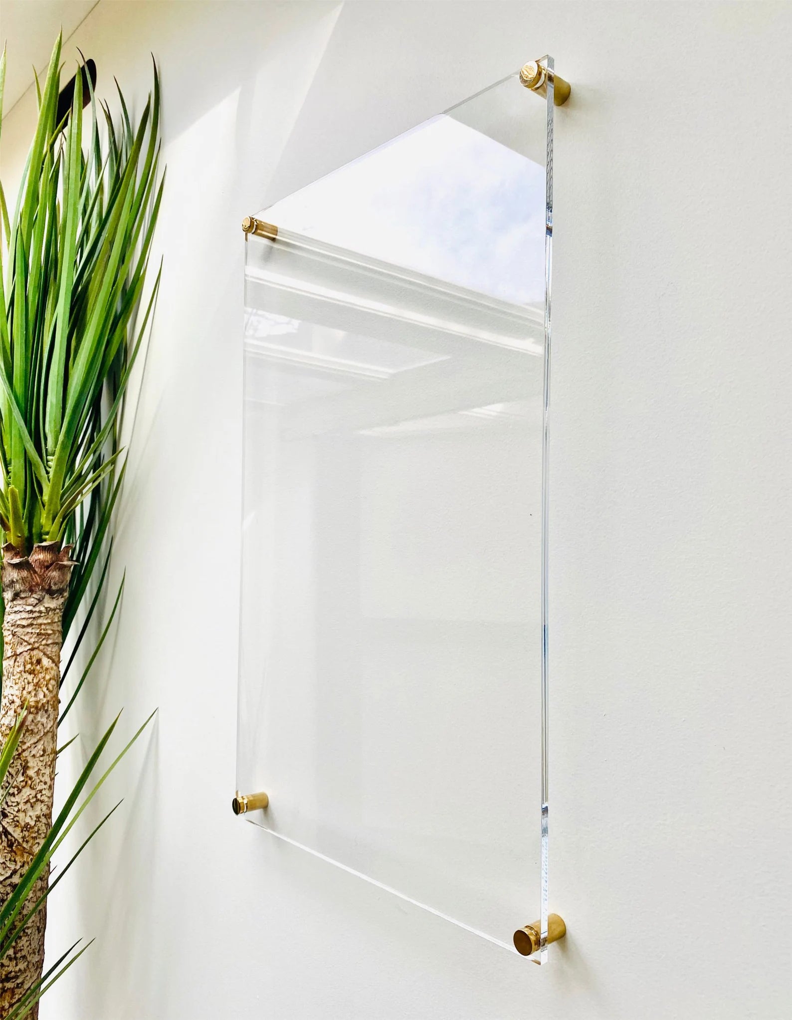 the clear acrylic dry erase board mounted on a wall