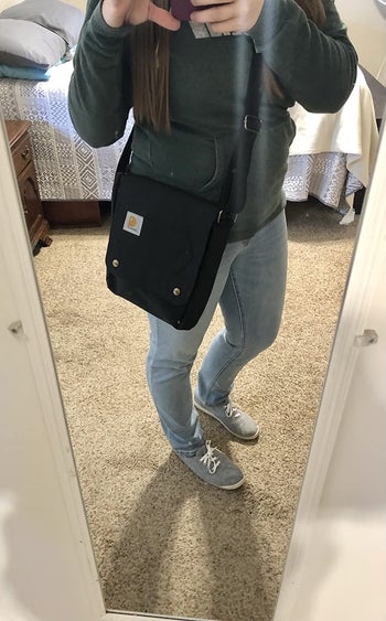 reviewer mirror selfie wearing the bag