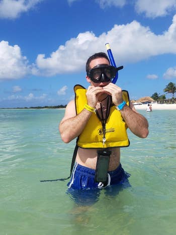 person using pouch while scuba diving