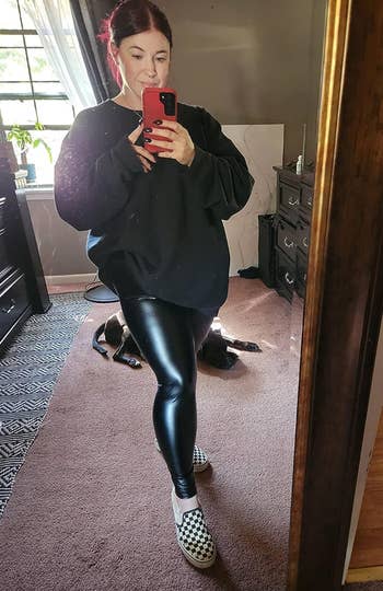 Reviewer in black faux leather leggings 