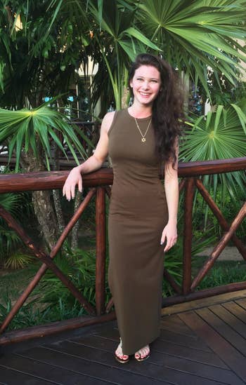 a reviewer wearing the olive dress