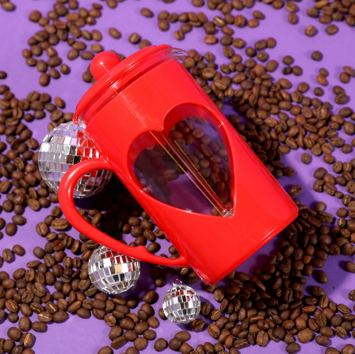 the gallic  property   laying connected  a aboveground  covered with java  beans and disco balls