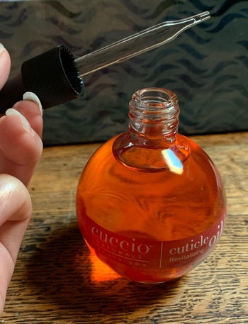 The cuticle oil bottle and dropper