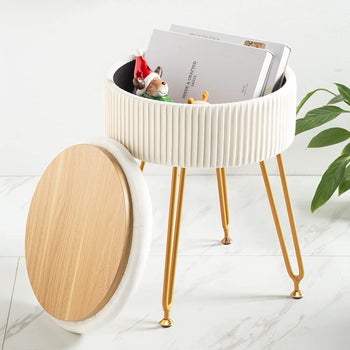 the stool in white with storage lid open 