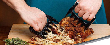 person shredding meat with the claws