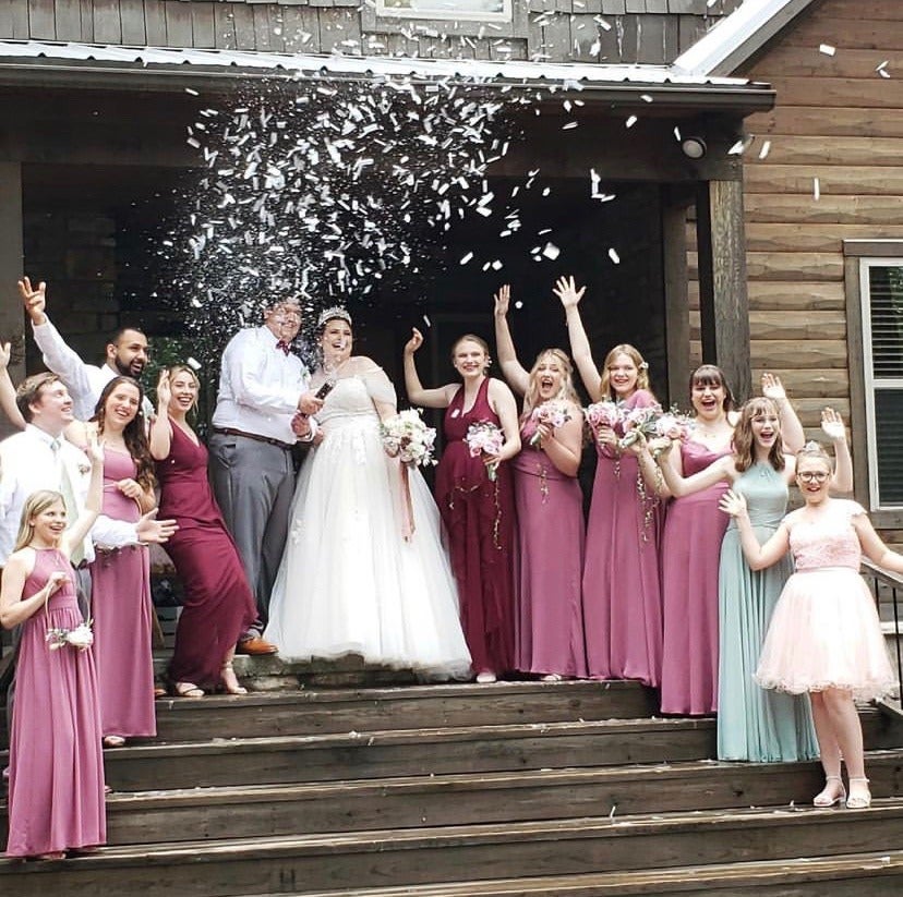 wedding party celebrating with confetti 