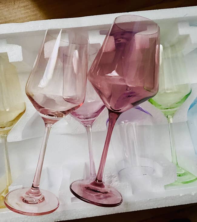 Several pastel-colored vino glasses successful a foam package, showcasing a stylish acceptable for location décor oregon acquisition shopping