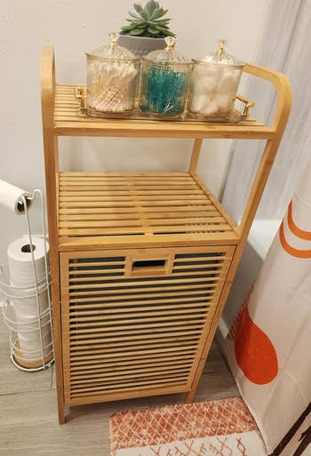 reviewer's bamboo retention support adjacent to shower