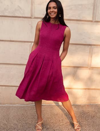 model wearing the bonbon dress in pink 