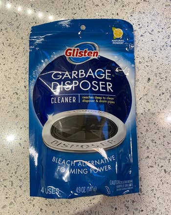 reviewer photo of the blue package of disposal cleaner