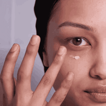 gif of a model applying eye cream to their under-eyes