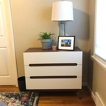 reviewer photo of the white dresser in a hallway