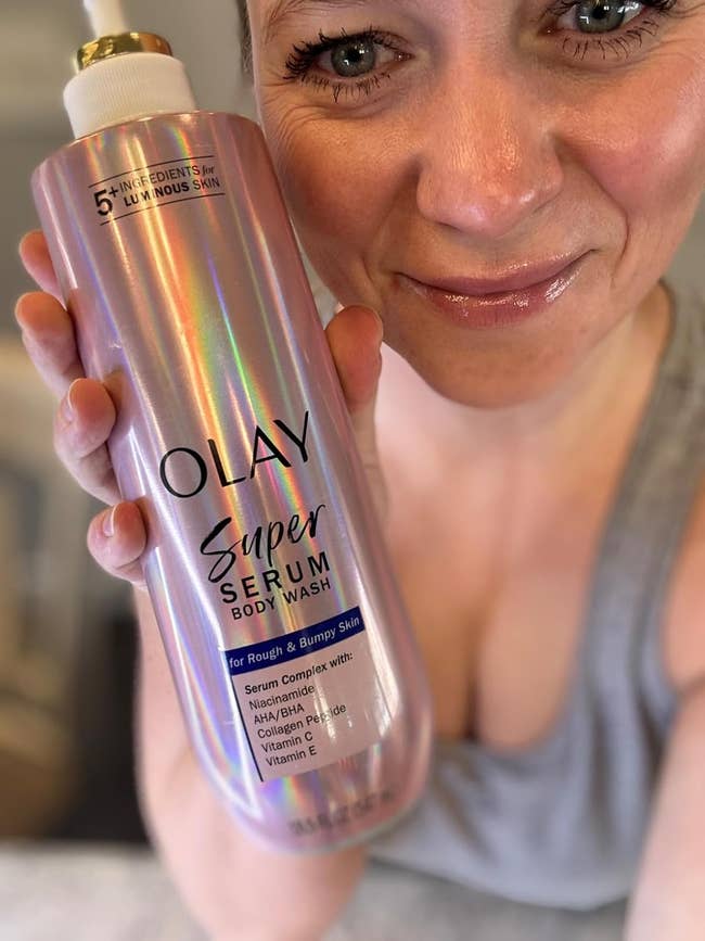 reviewer holding vessel of Olay serum assemblage wash