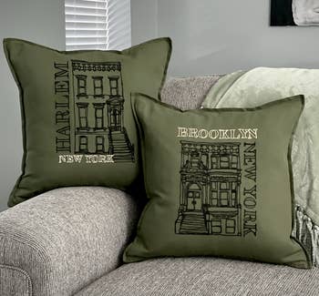 A green pillowcase with Brooklyn Brownstones