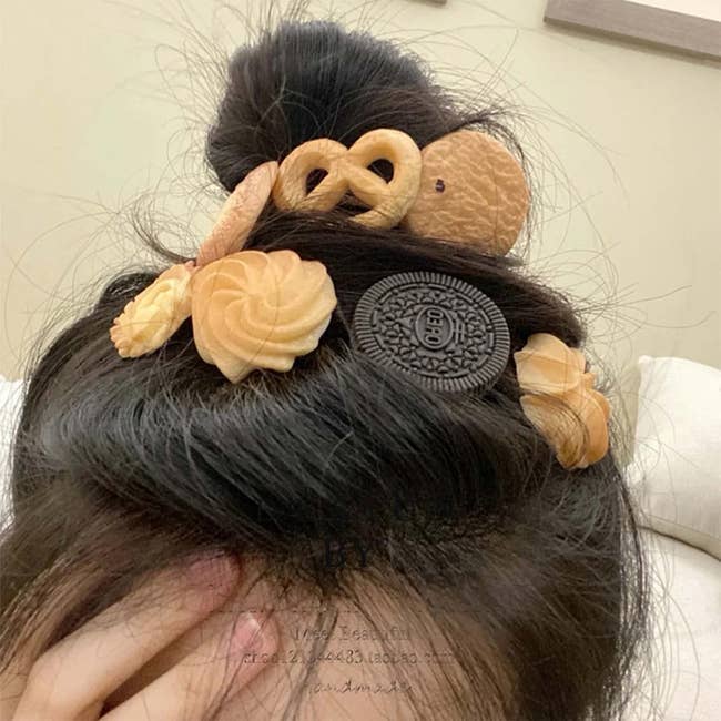 Hair styled with novelty clips resembling various cookies and baked goods