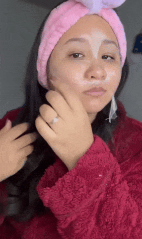 reviewer successful  cozy robe with skincare disguise  applied that is cautiously  being peeled off