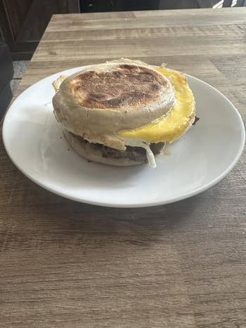 Breakfast sandwich with ovum  and food  connected  an English muffin