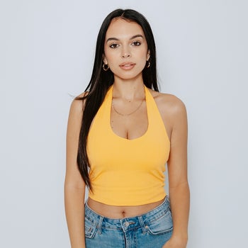 model in yellow/orange halter top