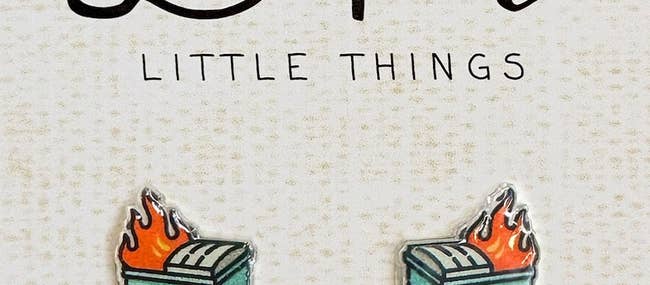 Earrings designed as tiny toasters with flames, labeled 