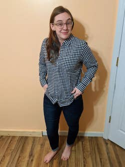 Reviewer wearing black and white gingham print top