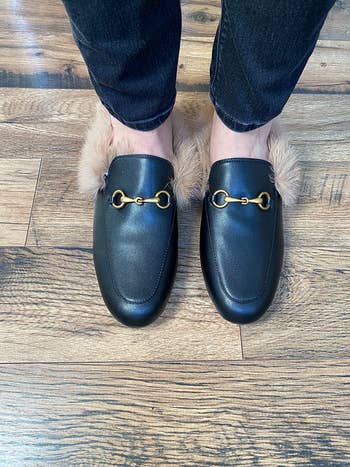 Close up of reviewer wearing the same loafers in black