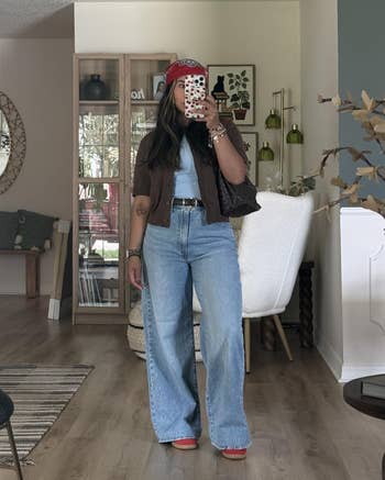 reviewer wearing the jeans with a casual outfit