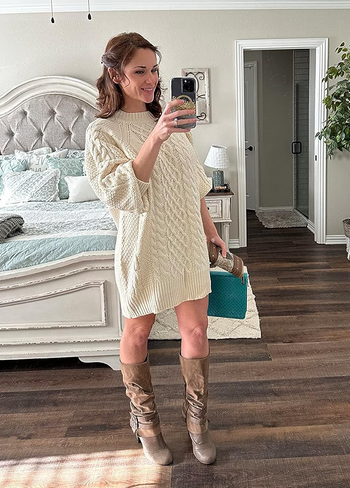 another reviewer wearing the sweater in cream