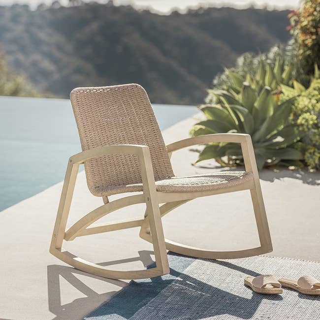 taupe outdoor rocking chair on a patio