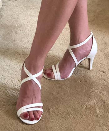 Reviewer wearing the white sandals