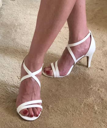 Reviewer wearing the white sandals