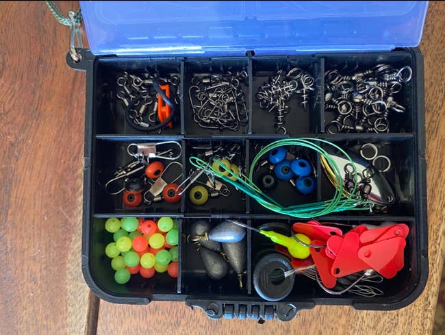 the case filled with fishing accessories