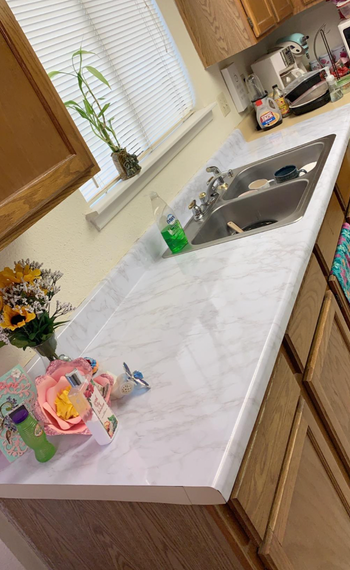 White marble contact paper on kitchen counters